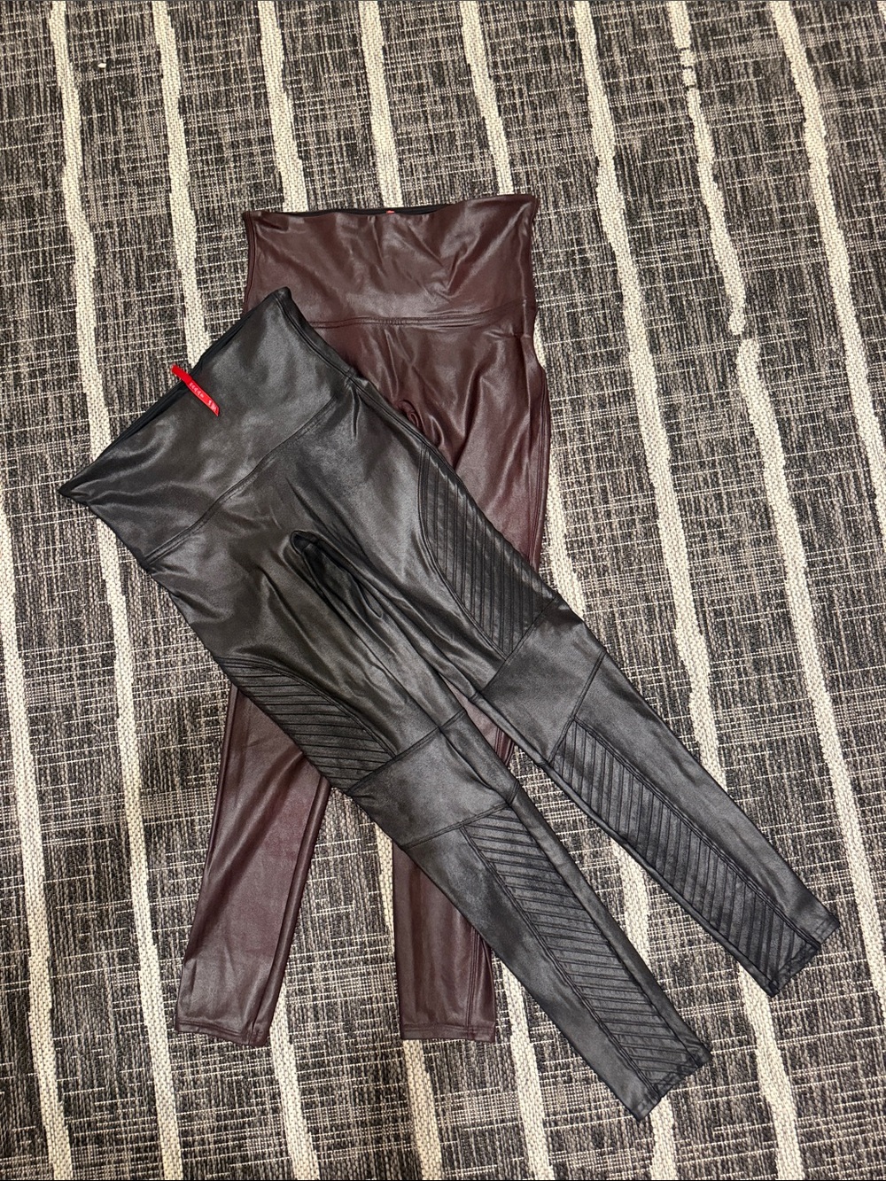 2 pairs of SPANX Faux Leather High-Waist Leggings in Black and Burgundy